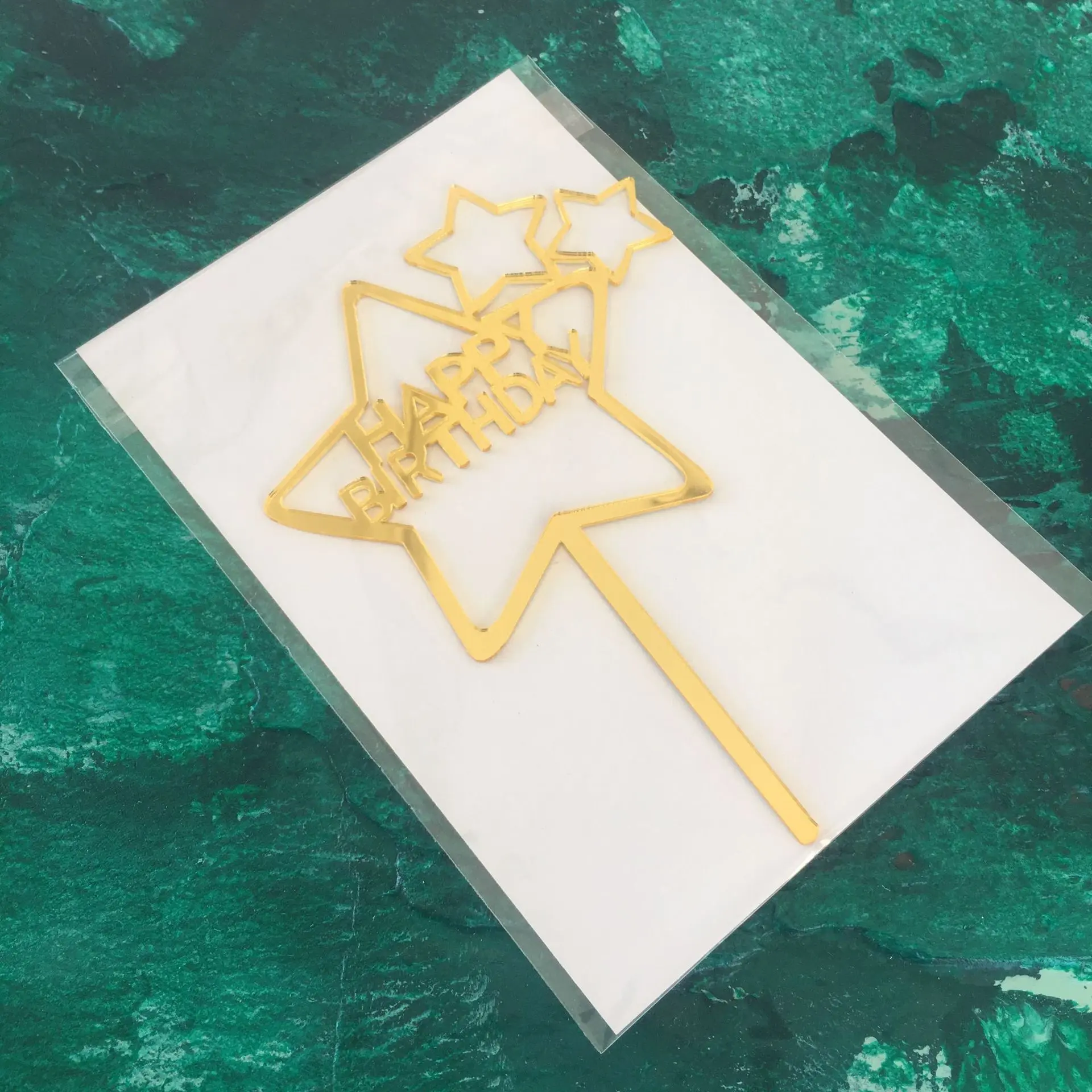 Golden star shaped happy birthday cake topper