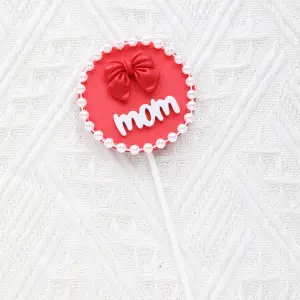 Mom with bow with pearl boarder cake topper