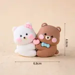 Cute brown and white bear couple hugging a heart toy topper